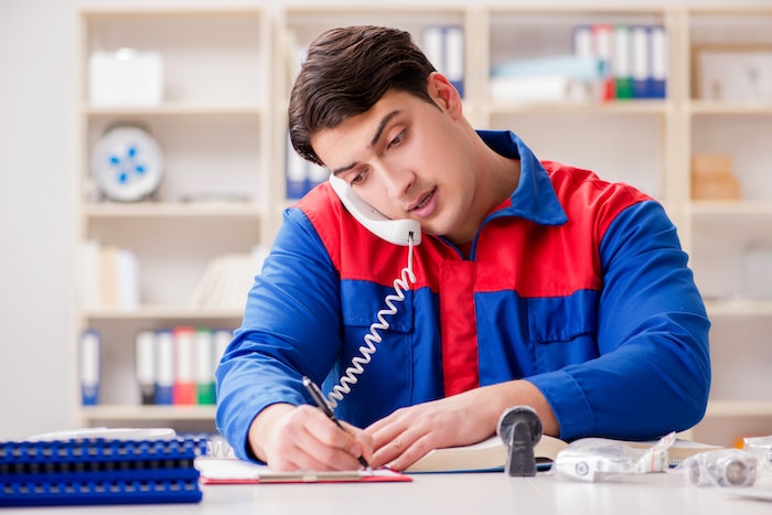 Worker in uniform working on project